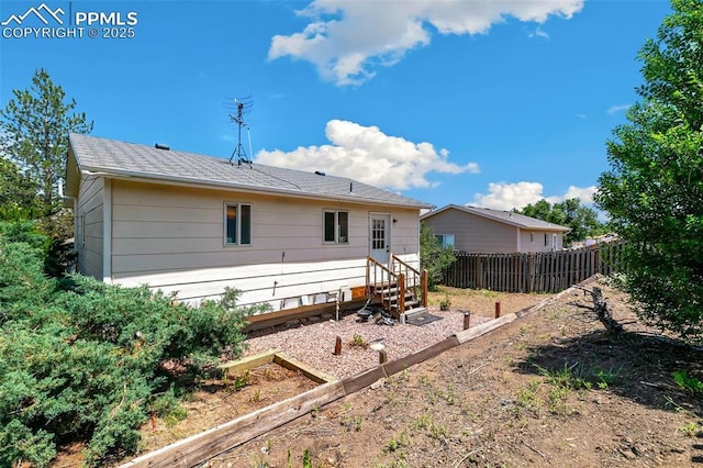 609 Wheat Field Rd, Fountain, CO 80817 - back of house with a vegetable garden and entry steps