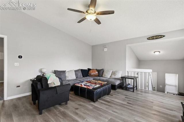 609 Wheat Field Rd, Fountain, CO 80817 - living area featuring ceiling fan, wood finished floors, and vaulted ceiling