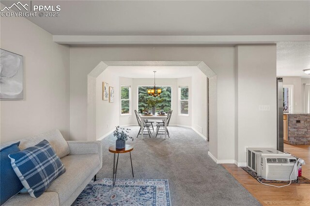 1410 Almagre Peak Dr, Colorado Springs, CO 80921 - living room with a chandelier and baseboards