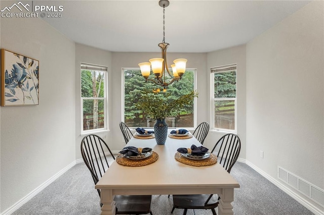 1410 Almagre Peak Dr, Colorado Springs, CO 80921 - dining area with carpet flooring, a chandelier, and plenty of natural light