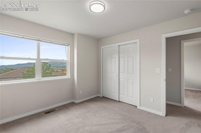 1410 Almagre Peak Dr, Colorado Springs, CO 80921 - unfurnished bedroom featuring carpet floors and a closet