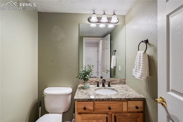 1410 Almagre Peak Dr, Colorado Springs, CO 80921 - bathroom featuring vanity and a textured wall