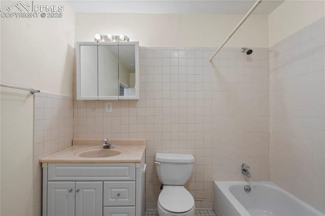 1410 Almagre Peak Dr, Colorado Springs, CO 80921 - bathroom with tile walls, vanity, and shower / bath combination