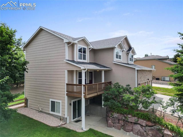1410 Almagre Peak Dr, Colorado Springs, CO 80921 - rear view of house featuring a garage and a shingled roof