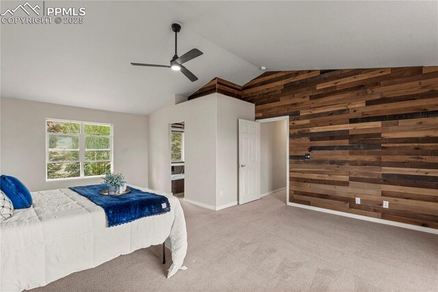 1410 Almagre Peak Dr, Colorado Springs, CO 80921 - bedroom with wooden walls, carpet floors, a ceiling fan, and high vaulted ceiling