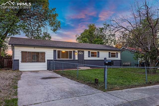 2075 Pepperwood Dr, Colorado Springs, CO 80910 - ranch-style home featuring brick siding, a fenced front yard, and driveway
