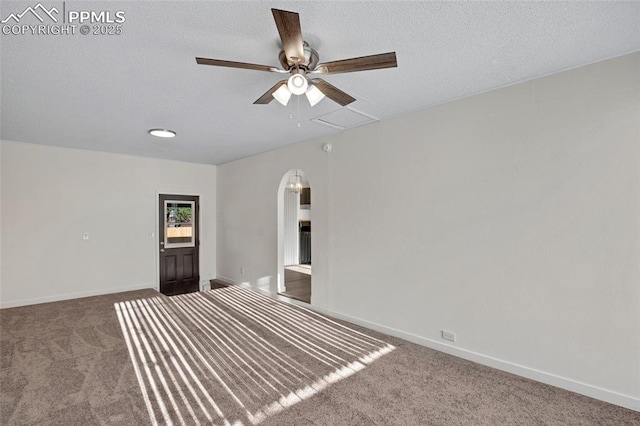 2075 Pepperwood Dr, Colorado Springs, CO 80910 - unfurnished bedroom with carpet floors, arched walkways, ensuite bath, a textured ceiling, and attic access