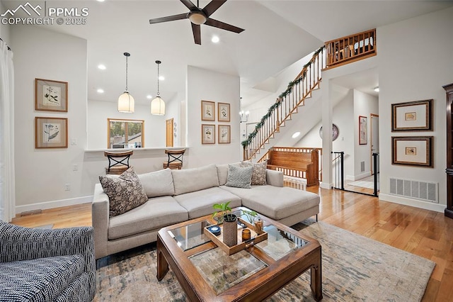 225 Laclede Ct, Colorado Springs, CO 80905 - living room featuring a ceiling fan, light wood-style floors, stairway, vaulted ceiling, and recessed lighting