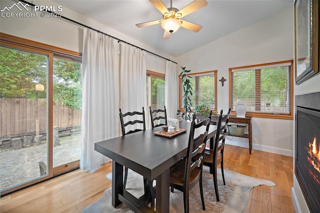 225 Laclede Ct, Colorado Springs, CO 80905 - dining space featuring light wood-style floors, lofted ceiling, healthy amount of natural light, and ceiling fan