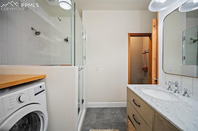225 Laclede Ct, Colorado Springs, CO 80905 - full bath with washer / dryer, a shower stall, and vanity
