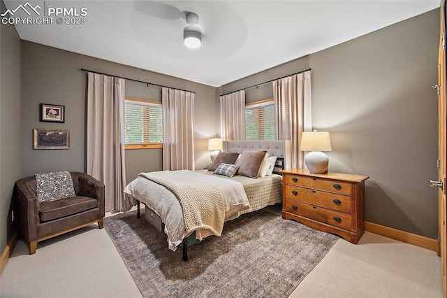 225 Laclede Ct, Colorado Springs, CO 80905 - carpeted bedroom with multiple windows and a ceiling fan