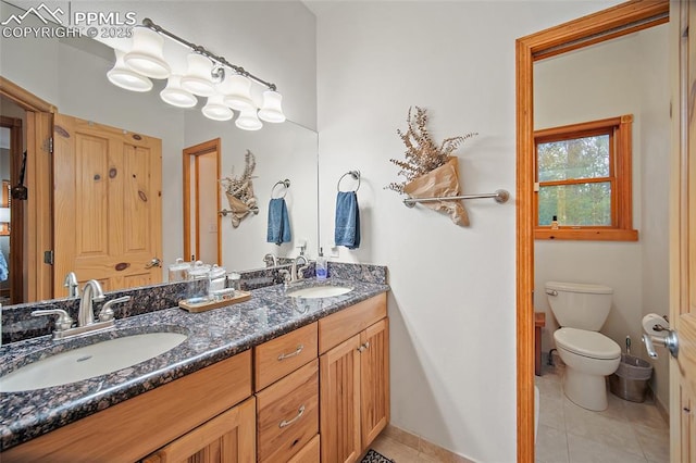 225 Laclede Ct, Colorado Springs, CO 80905 - bathroom with double vanity and tile patterned floors