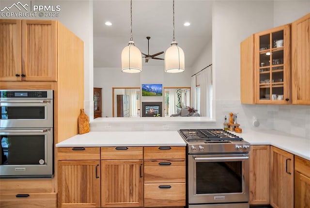 225 Laclede Ct, Colorado Springs, CO 80905 - kitchen with appliances with stainless steel finishes, glass insert cabinets, backsplash, light countertops, and recessed lighting