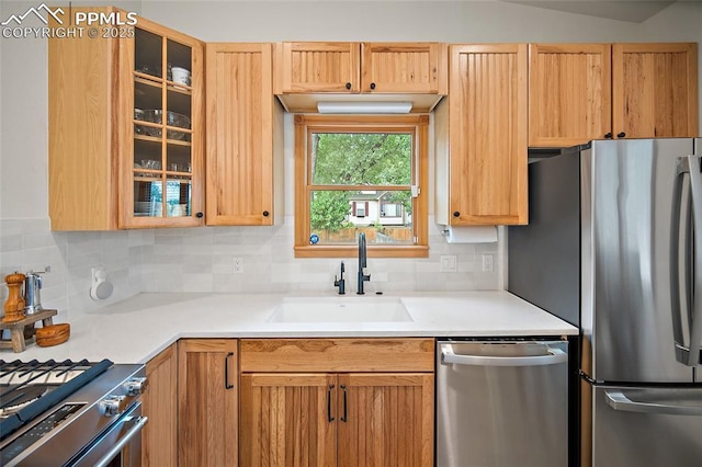 225 Laclede Ct, Colorado Springs, CO 80905 - kitchen with stainless steel appliances, backsplash, glass insert cabinets, and light countertops