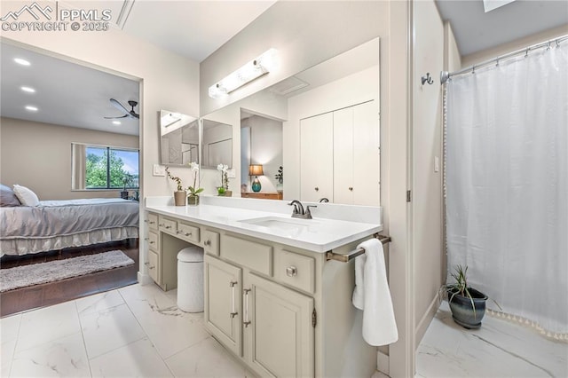910 Fontmore Rd Unit D, Colorado Springs, CO 80904 - ensuite bathroom featuring marble look tile flooring, vanity, and recessed lighting
