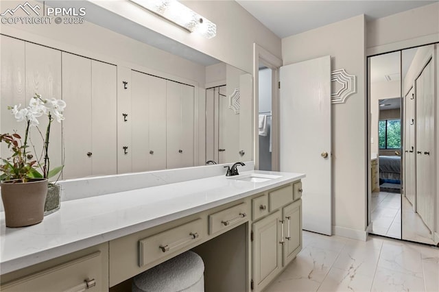 910 Fontmore Rd Unit D, Colorado Springs, CO 80904 - ensuite bathroom with marble look tiles and vanity