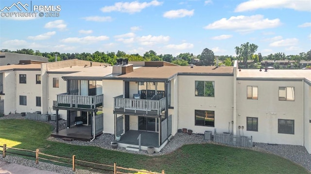 910 Fontmore Rd Unit D, Colorado Springs, CO 80904 - rear view of house with a balcony and a patio area