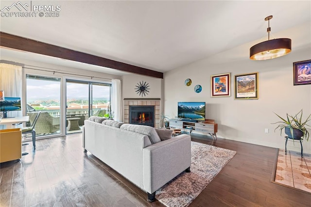 910 Fontmore Rd Unit D, Colorado Springs, CO 80904 - living room with dark wood-type flooring, beamed ceiling, and a tile fireplace