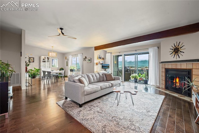 910 Fontmore Rd Unit D, Colorado Springs, CO 80904 - living area featuring dark wood-style flooring, ceiling fan, beam ceiling, and a tile fireplace