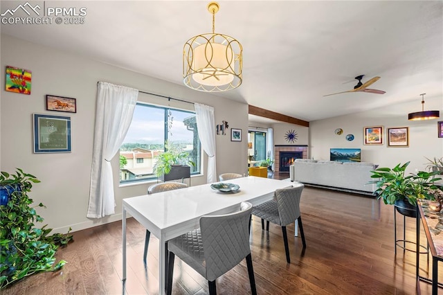 910 Fontmore Rd Unit D, Colorado Springs, CO 80904 - dining area with dark wood-style floors, a glass covered fireplace, and a ceiling fan