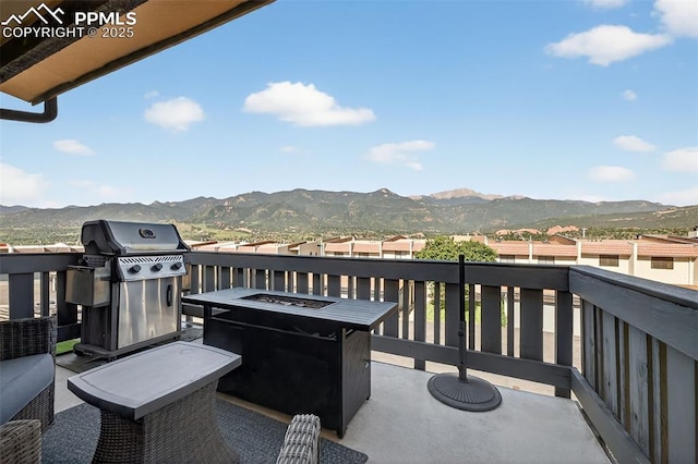 910 Fontmore Rd Unit D, Colorado Springs, CO 80904 - balcony featuring a mountain view, a grill, and an outdoor fire pit