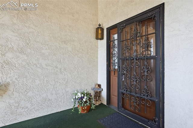 910 Fontmore Rd Unit D, Colorado Springs, CO 80904 - doorway to property with stucco siding