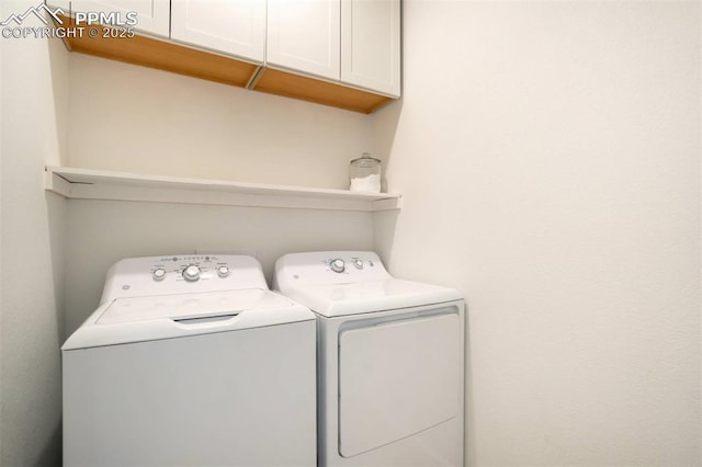 4887 Wolf Moon Dr, Colorado Springs, CO 80911 - laundry room featuring cabinet space and independent washer and dryer