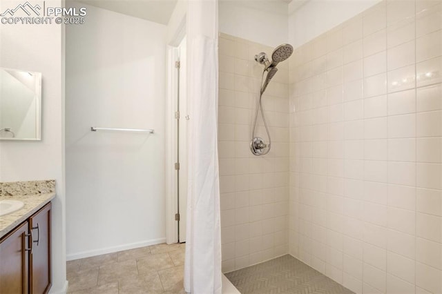 4887 Wolf Moon Dr, Colorado Springs, CO 80911 - bathroom with vanity and a tile shower