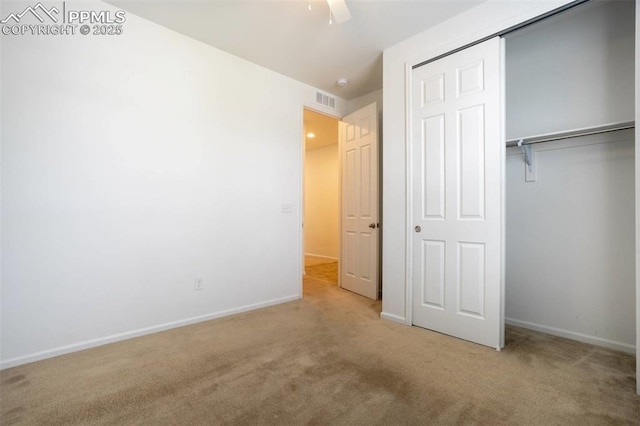 4887 Wolf Moon Dr, Colorado Springs, CO 80911 - unfurnished bedroom featuring carpet floors, a closet, and a ceiling fan