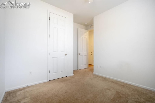 4887 Wolf Moon Dr, Colorado Springs, CO 80911 - unfurnished bedroom featuring carpet floors and baseboards