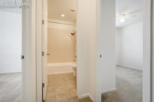 4887 Wolf Moon Dr, Colorado Springs, CO 80911 - hall featuring light carpet and light tile patterned flooring