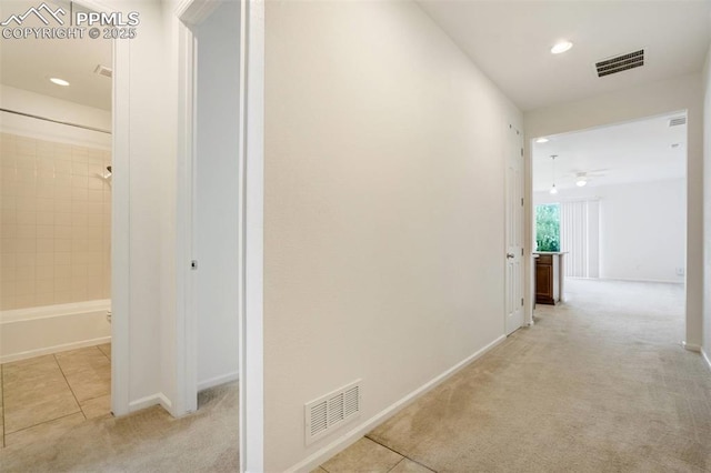 4887 Wolf Moon Dr, Colorado Springs, CO 80911 - hall with carpet flooring, recessed lighting, and tile patterned floors