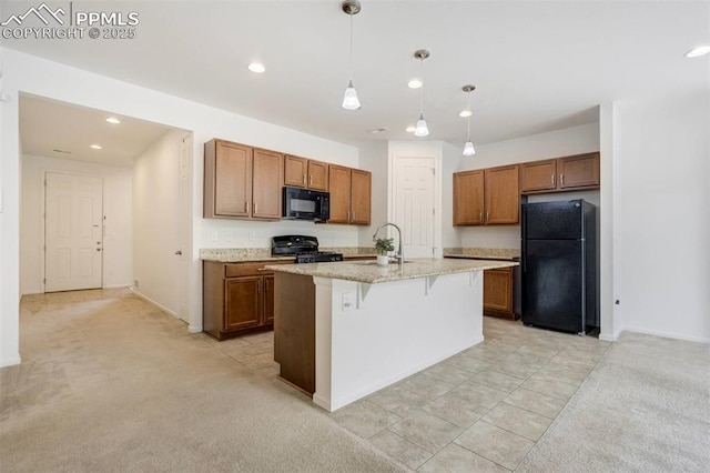 4887 Wolf Moon Dr, Colorado Springs, CO 80911 - kitchen featuring black appliances, brown cabinetry, a breakfast bar area, light stone countertops, and recessed lighting