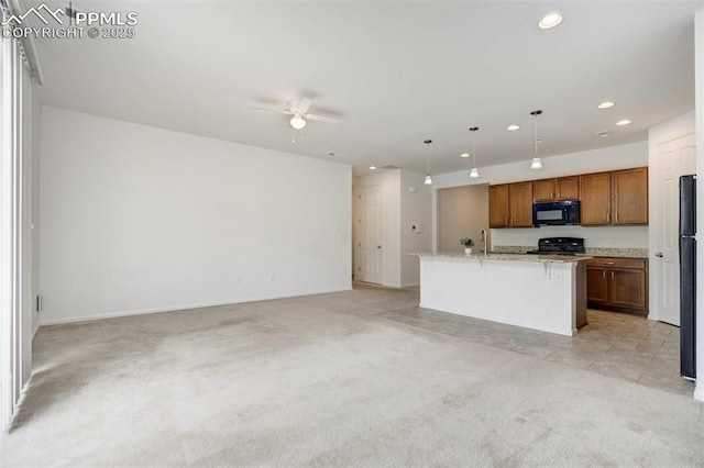4887 Wolf Moon Dr, Colorado Springs, CO 80911 - kitchen with black microwave, open floor plan, a ceiling fan, light colored carpet, and recessed lighting