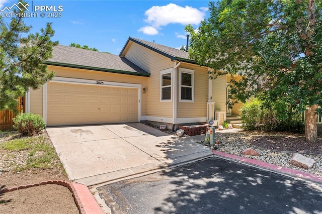 3025 Ebbtide Vw, Colorado Springs, CO 80922 - view of front of house with a garage and concrete driveway