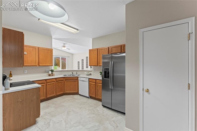 3025 Ebbtide Vw, Colorado Springs, CO 80922 - kitchen with stainless steel fridge with ice dispenser, white dishwasher, a ceiling fan, vaulted ceiling, and brown cabinetry