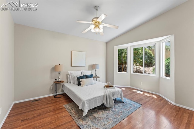 3025 Ebbtide Vw, Colorado Springs, CO 80922 - bedroom featuring wood finished floors, vaulted ceiling, and a ceiling fan