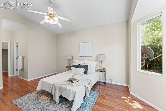 3025 Ebbtide Vw, Colorado Springs, CO 80922 - bedroom featuring lofted ceiling, wood finished floors, and a ceiling fan