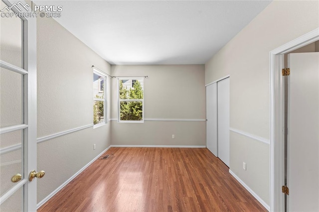 3025 Ebbtide Vw, Colorado Springs, CO 80922 - unfurnished bedroom with wood finished floors and a closet