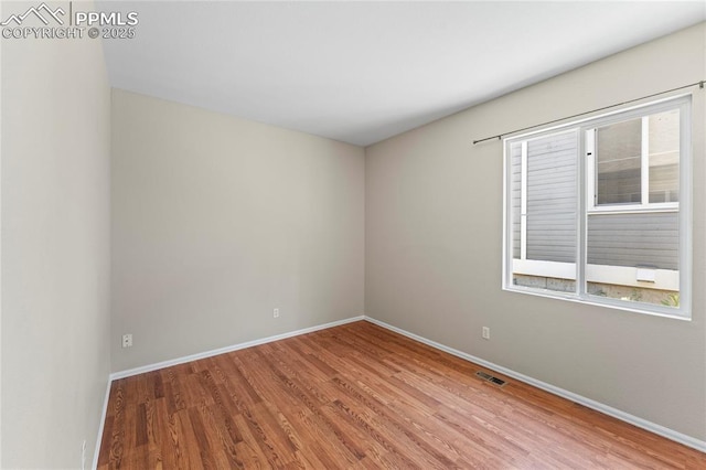 3025 Ebbtide Vw, Colorado Springs, CO 80922 - unfurnished room with wood finished floors and baseboards