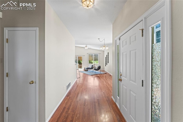 3025 Ebbtide Vw, Colorado Springs, CO 80922 - foyer entrance featuring wood finished floors, a chandelier, and ceiling fan
