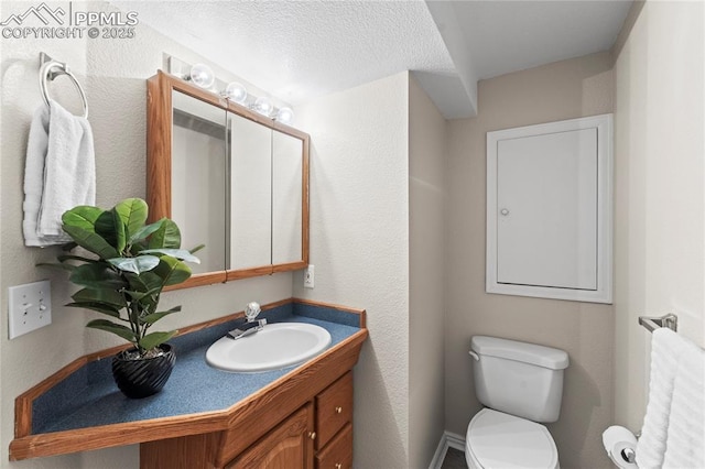 3025 Ebbtide Vw, Colorado Springs, CO 80922 - half bath featuring vanity and a textured ceiling