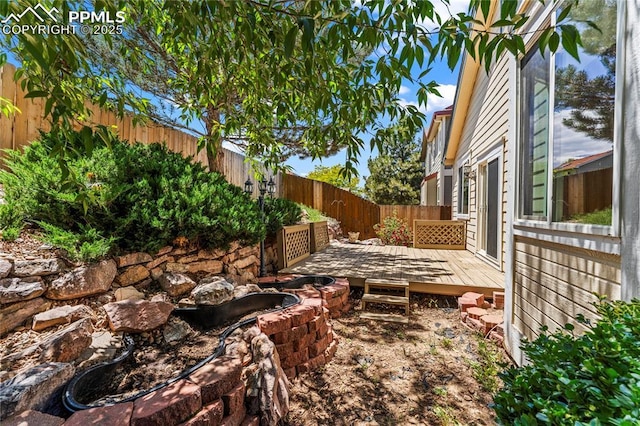 3025 Ebbtide Vw, Colorado Springs, CO 80922 - fenced backyard featuring a wooden deck