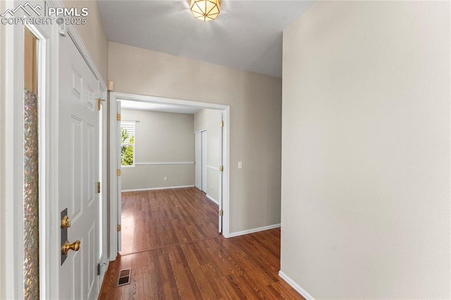 3025 Ebbtide Vw, Colorado Springs, CO 80922 - hall with dark wood-style flooring and baseboards