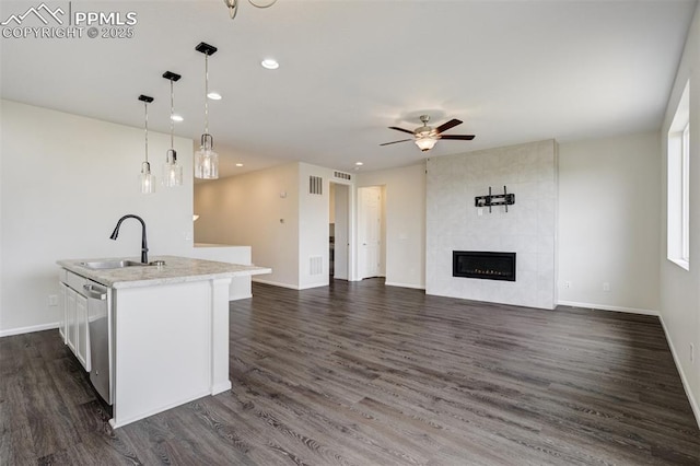 7119 Passing Sky Dr, Colorado Springs, CO 80911 - kitchen featuring a ceiling fan, light countertops, recessed lighting, open floor plan, and dark wood finished floors