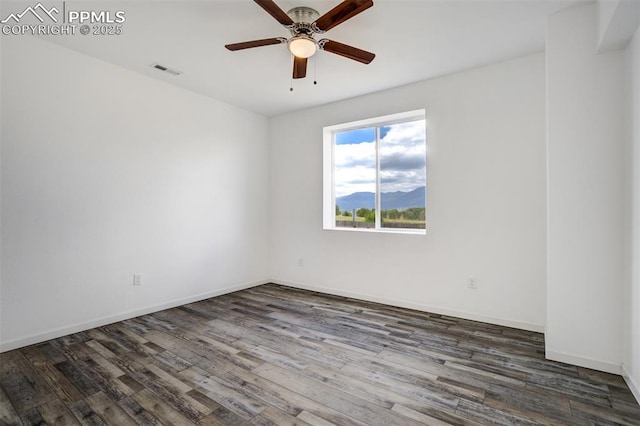 7119 Passing Sky Dr, Colorado Springs, CO 80911 - spare room with ceiling fan and dark wood-style flooring