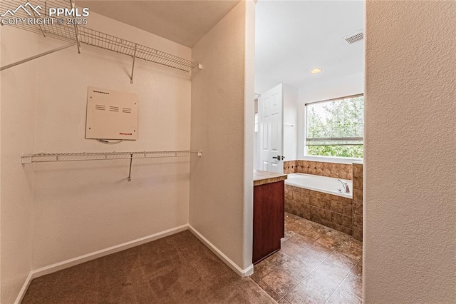 2513 Gilpin Ave, Colorado Springs, CO 80910 - spacious closet featuring tile patterned floors