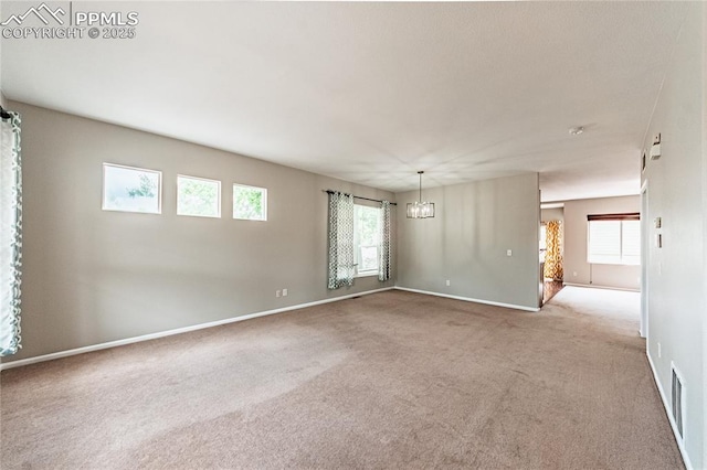 2513 Gilpin Ave, Colorado Springs, CO 80910 - carpeted spare room featuring a chandelier and baseboards