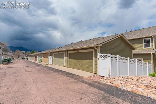 2513 Gilpin Ave, Colorado Springs, CO 80910 - view of road featuring community garages, a residential view, and a mountain view
