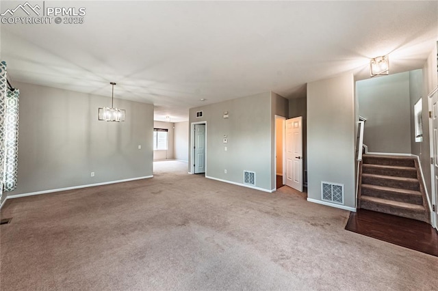 2513 Gilpin Ave, Colorado Springs, CO 80910 - unfurnished living room featuring carpet flooring, a chandelier, and stairway